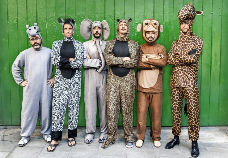 Group of five men in African animal costumes representing the more in-depth insights provided by psychographic segmentation